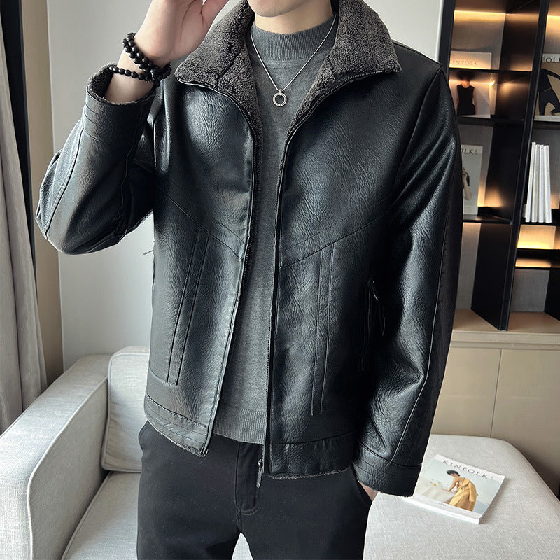 Person wearing a black leather jacket in an indoor setting