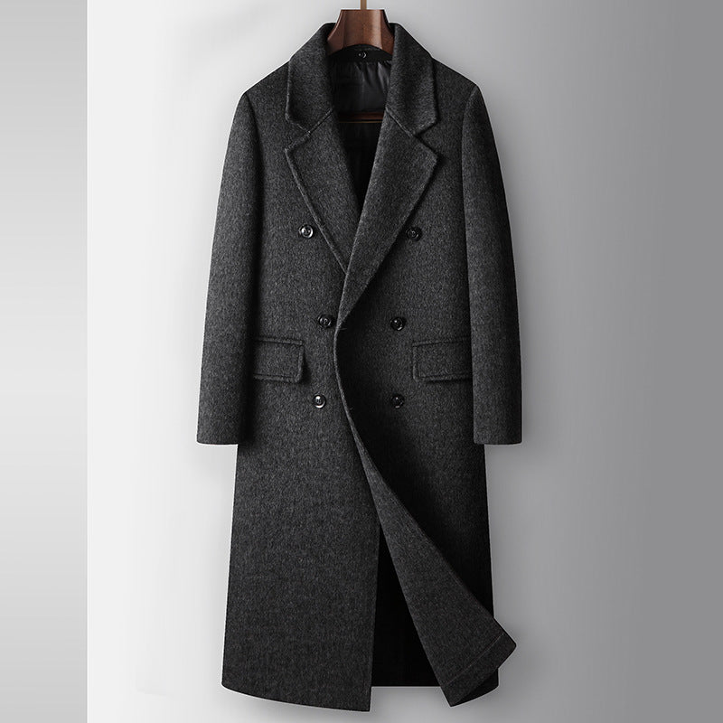 Gray overcoat on a hanger against a light gray background