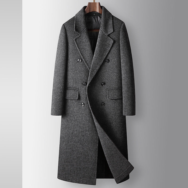 Gray overcoat on a mannequin against a gray background