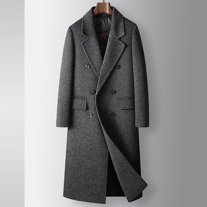 Gray overcoat on a mannequin against a gray background