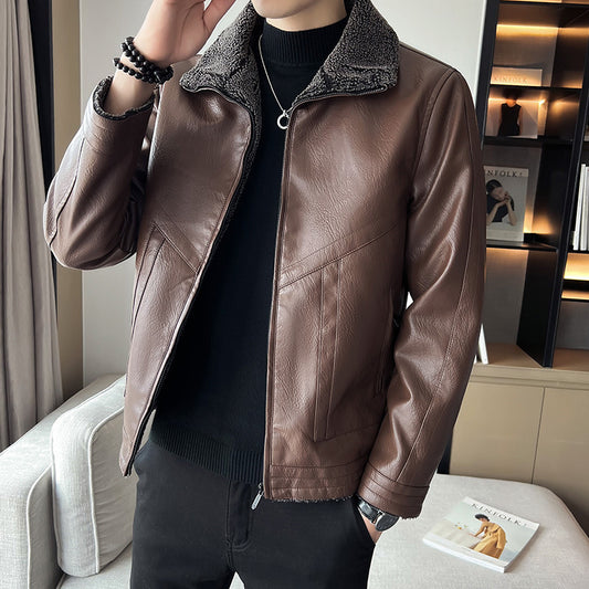 Person wearing a brown leather jacket in an indoor setting